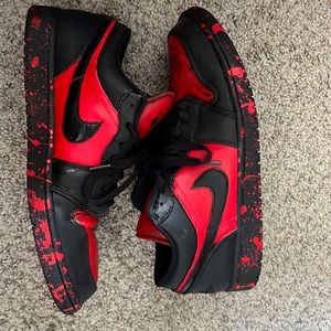 Custom air Jordan 1 black and red with red and black splatters on the shoe
